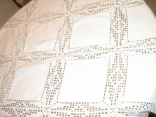 Beautiful handmade crocheted tablecloth with round inserts