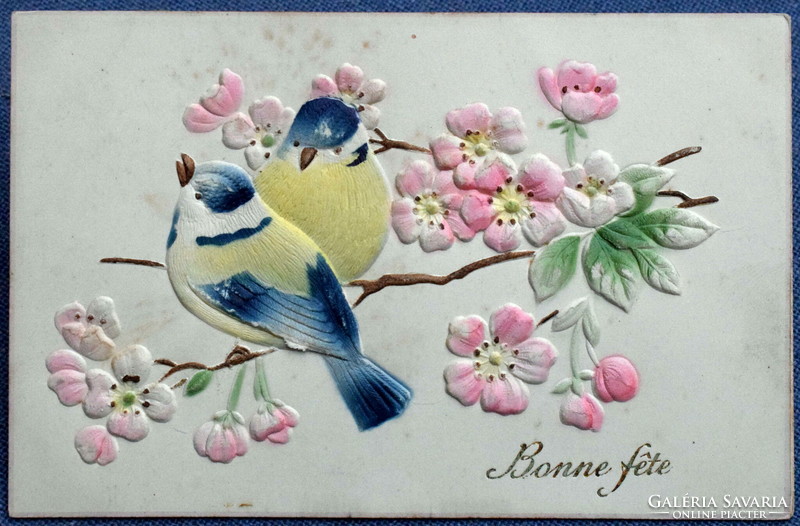 Antique embossed greeting multi-layered postcard on a branch with flowers