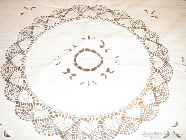 Beautiful white lace tablecloth with lacy edges and embroidered embroidered rice