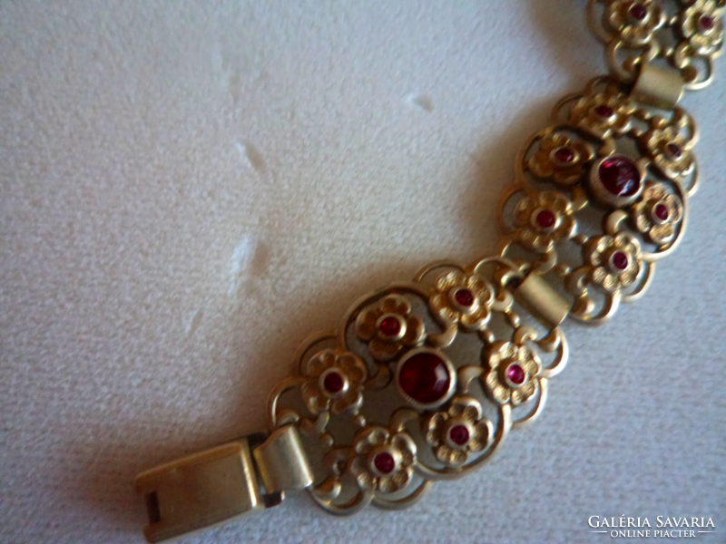 Beautiful gold-plated bracelet_ with small burgundy stones