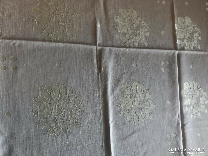 Damask tablecloth with a cream grape and grape leaf motif
