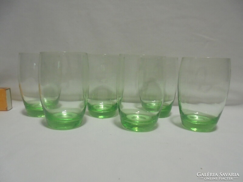 Six old, pale green water, wine or soda glasses together