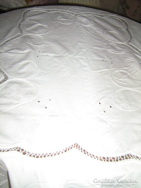 Beautiful ribbon embroidered on special white lace tablecloth