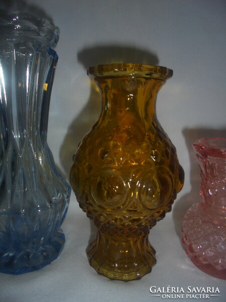 Four old glass vases together - amber, blue, pink, white