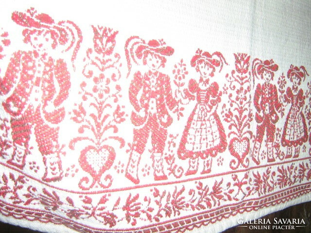 Beautiful vintage bavarian motif burst on white background Tyrolean girl-boy and floral kind woven tablecloth