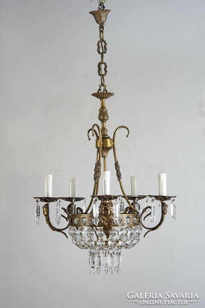 Gilded bronze frame chandelier with putto head decoration and crystal pendants