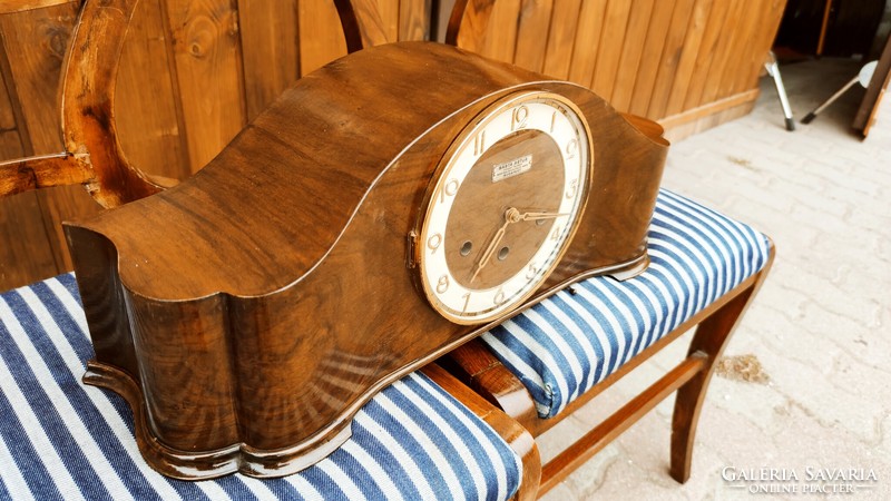 A working kienzle table clock playing the music of Westminster, with a quarter strike, marked, from about 1930