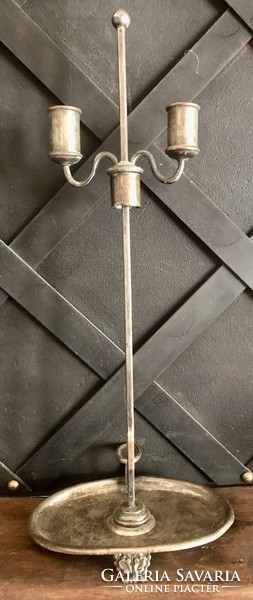 Old metal, adjustable candle holder