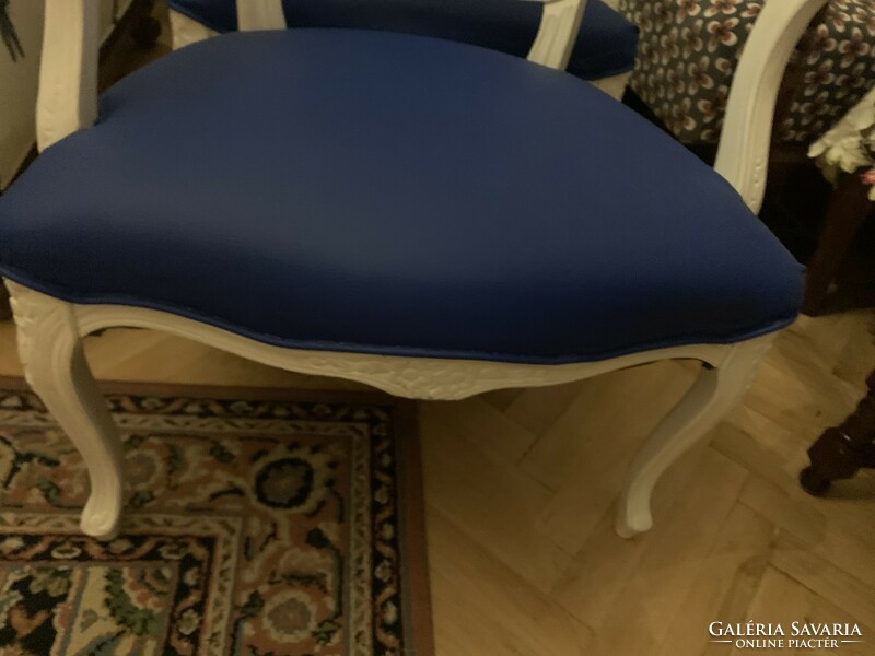 Pair of royal blue chairs with white arms