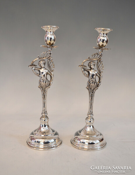 Silver double candle holder with plastic figure