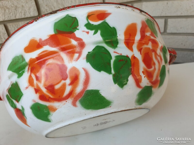 Old enameled bowl with a crown crest and rose pattern