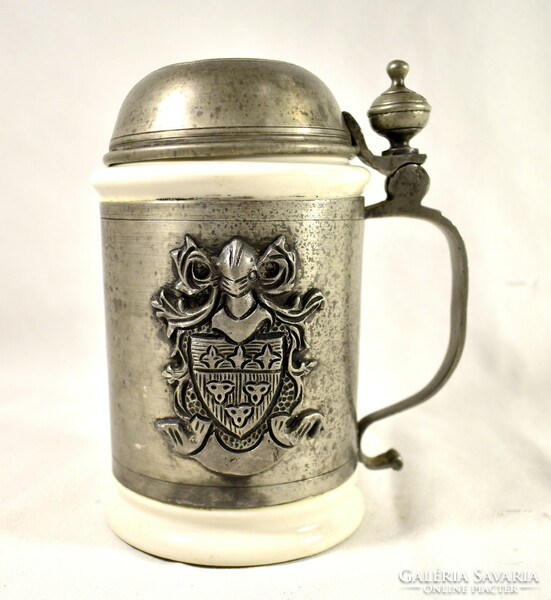 A jug with a tin lid and a porcelain insert with a coat of arms!
