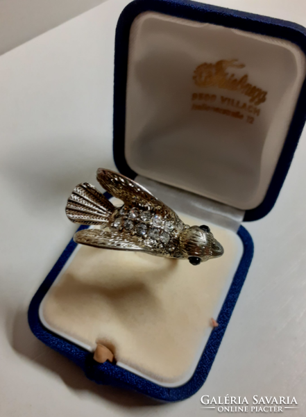 Nice condition gold-colored steel fashion ring with a large bird's head, studded with small white stones