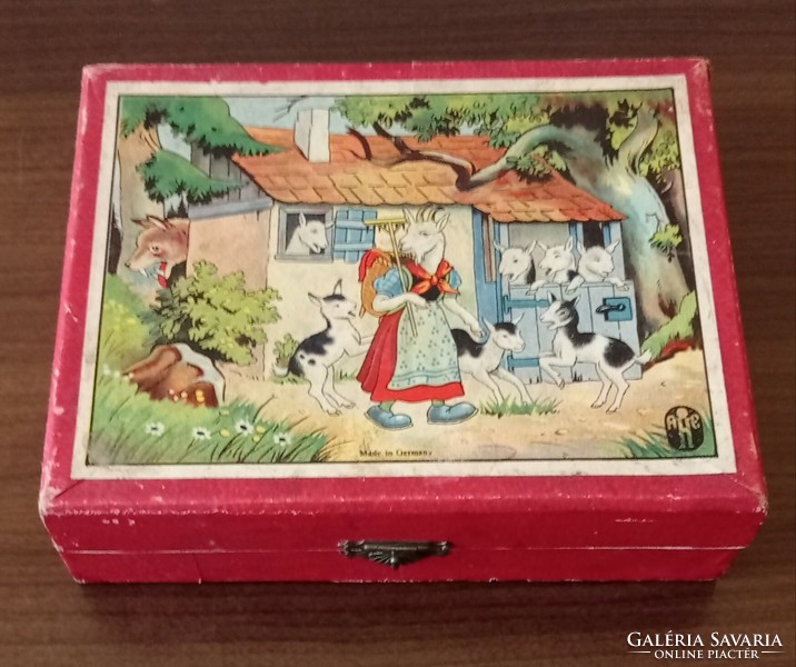 Old 12-piece puzzle cube in a wooden box