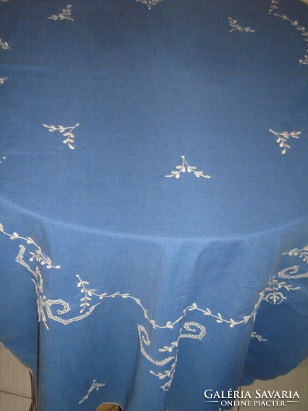 Beautiful white hand-embroidered azure gentian blue filigree light table runner