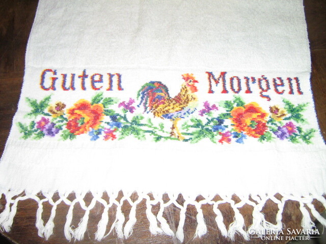 Wonderful rooster and floral pattern in snow-white decorative towels