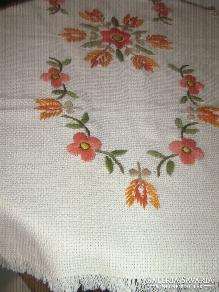 Beautiful hand-embroidered floral tablecloth runner with fringed edges