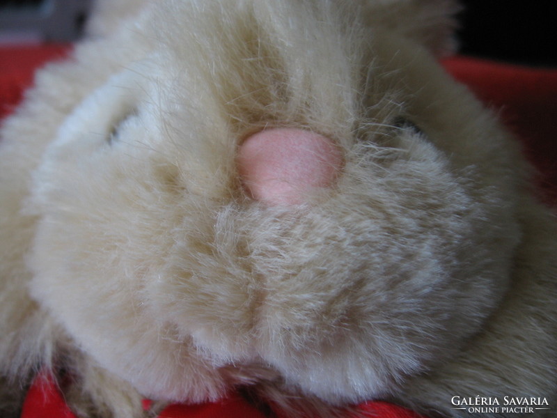Soft, long-furred plush bunny with vest