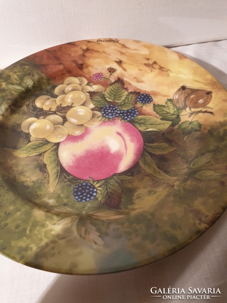 Marked French porcelain wall plate with lemonade