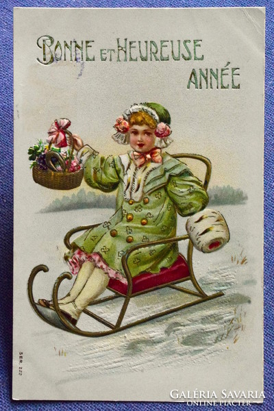 Antique embossed New Year litho postcard - sledding girl with basket clover lucky horseshoe