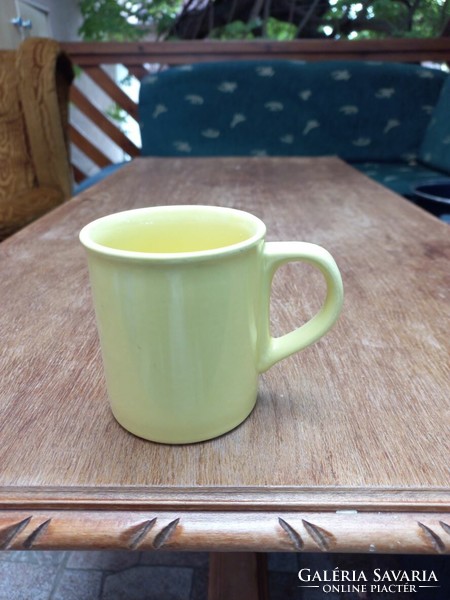 2 yellow ceramic mugs