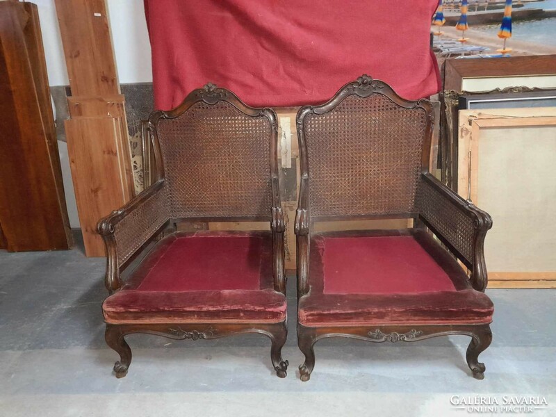 A wicker neobaroque armchair with a pair of burgundy upholstery