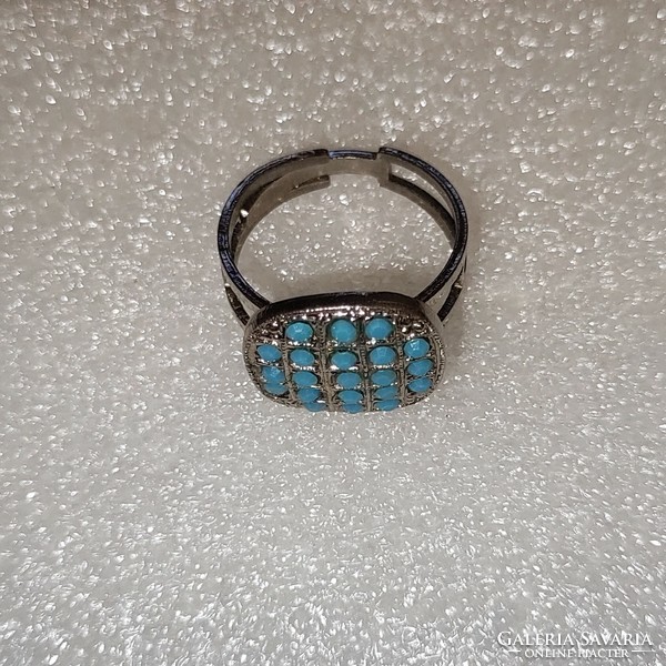 Adjustable ring with turquoise colored crystal stones