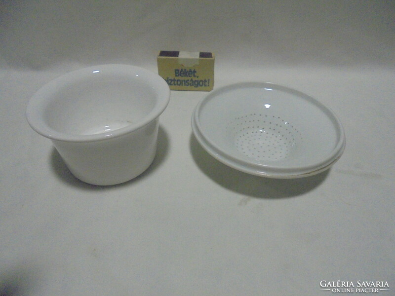 Two old porcelain tea filters together