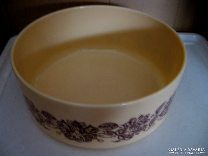 Retro beige plastic bowl with brown flowers