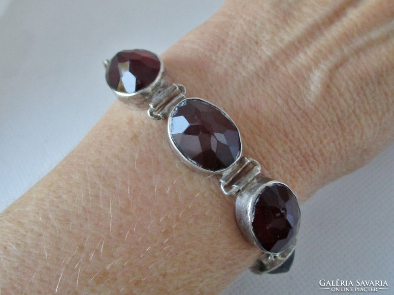 Very nice old silver bracelet with garnet red cast glass stones