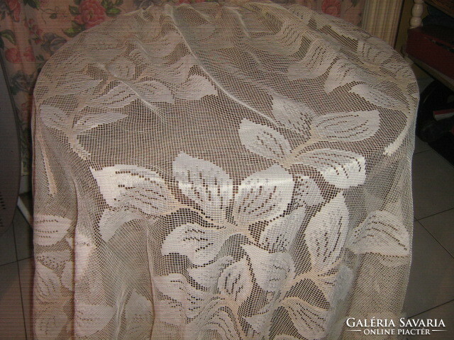 Beautiful huge ecru-white antique curtain with leaves