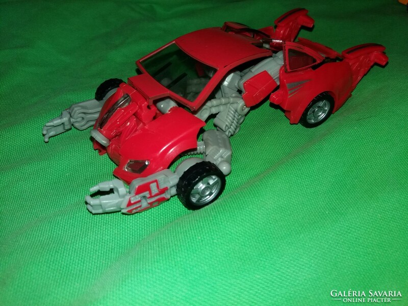 Red sports car transformers robot car 17 cm, good condition according to the pictures