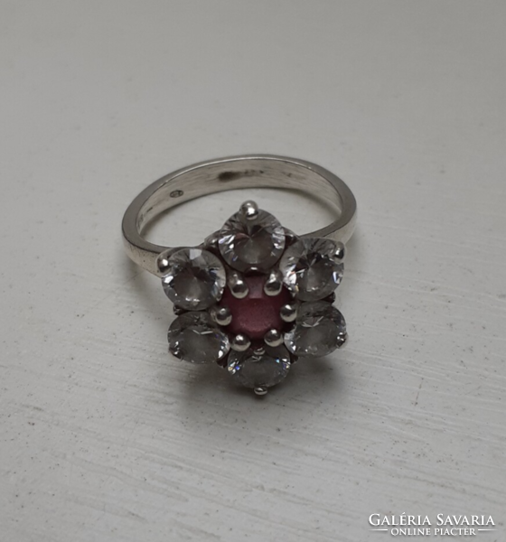 Marked silver ring with white polished set white stones in the center with a pink stone