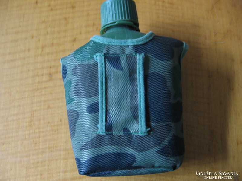Plastic water bottle in a terrain pattern cover