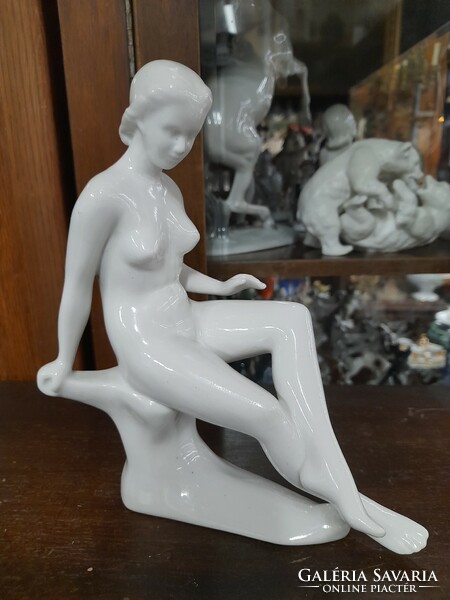 Sitting female nude figural porcelain statue. Marked. 22 Cm.
