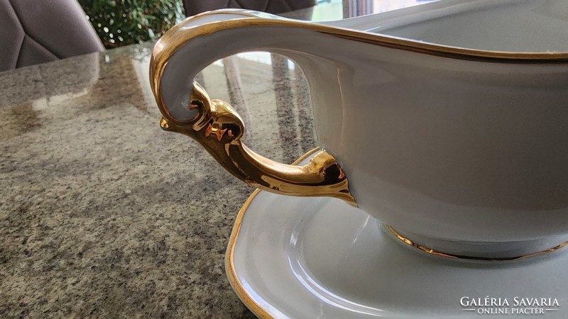 High-quality gilded porcelain tableware with sauce is complementary