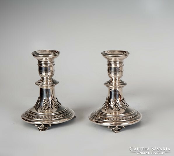 Pair of silver candle holders - decorated with griffins