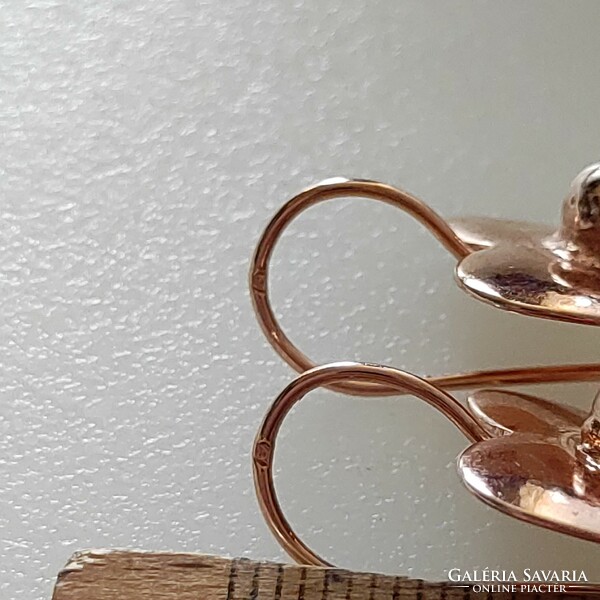 Brand new rose gold plated steel earrings marked