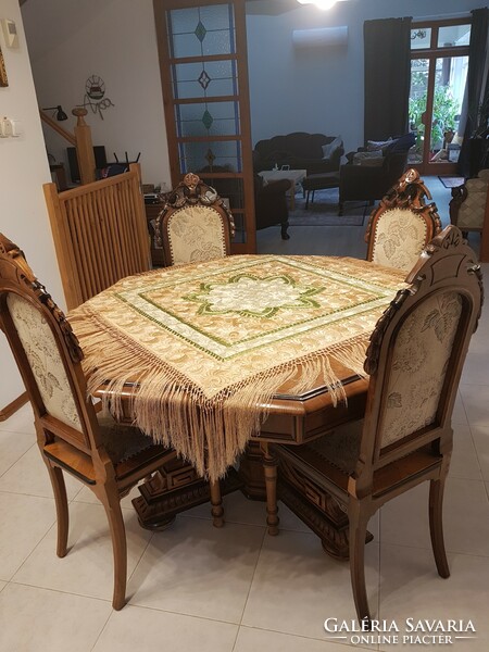 Antique extendable dining table with 6 carved upholstered chairs