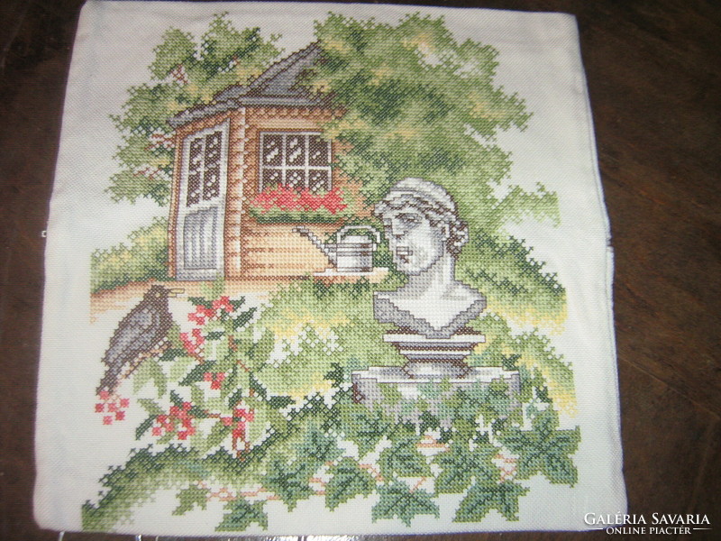 Beautiful vintage-style decorative pillow with cross-stitch embroidery