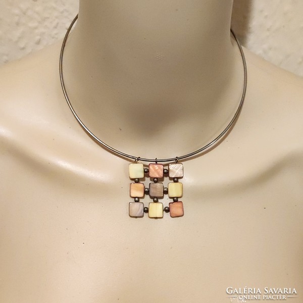 Rigid neck strap with shell pendant