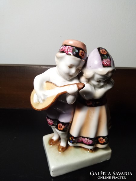 Pair of popular porcelain figurines