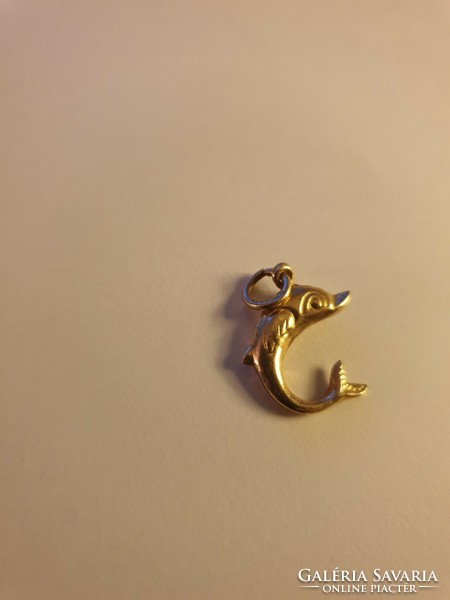 Dolphins gold pendant