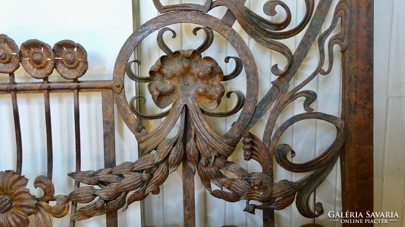 Antique wrought iron window frame frame grill from a French apartment house, with many plastic shapes + 1 railing