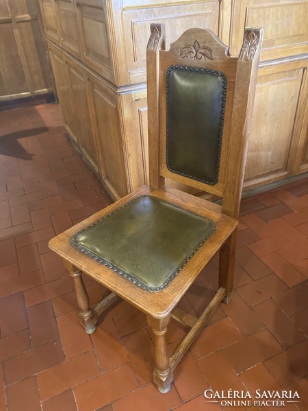 Solid oak dining chair with carved decoration, leather seat and backrest