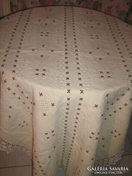 Beautiful embroidered elegant tablecloth with hand-crocheted edges