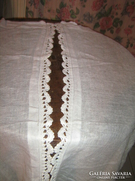 A pair of beautiful vintage white stained glass curtains with hand crocheted edges