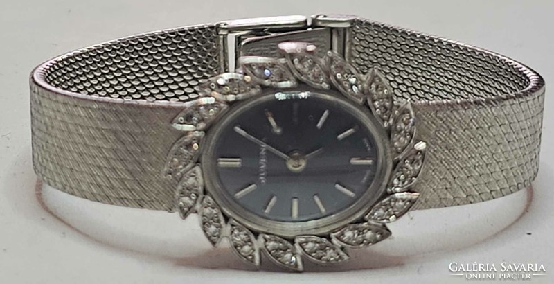 18K white gold women's watch with diamond stones.