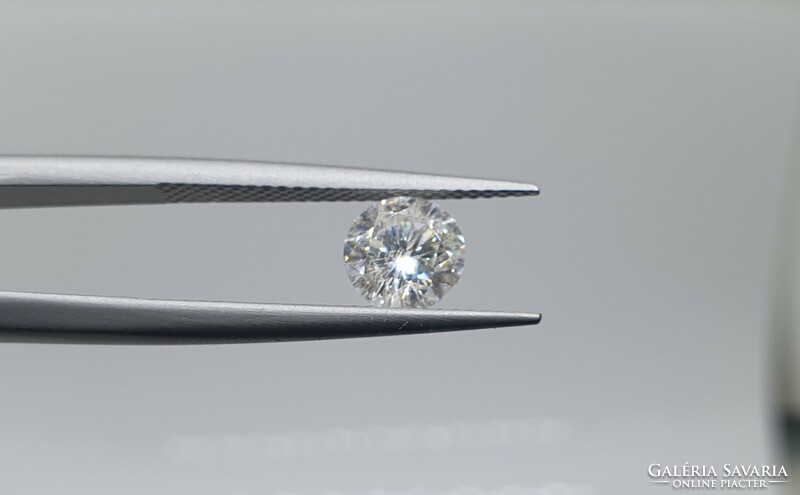0.95 carat brill cut moissanite. With certification.