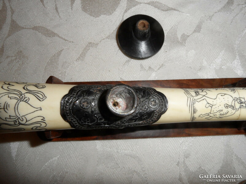 Far Eastern hand-painted, bone opium pipe on a wooden stand